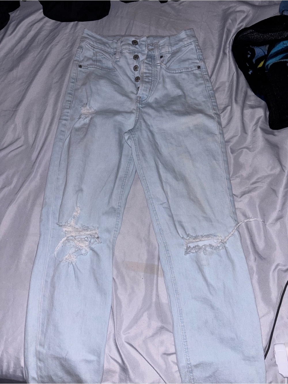 High-Rise Light Wash Ripped Women’s Jeans